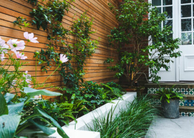 cedar batten fencing and raised planters in contemporary garden