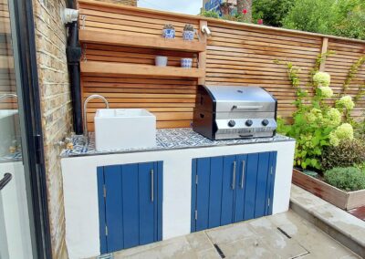 High end barbeque with cupboards and sink